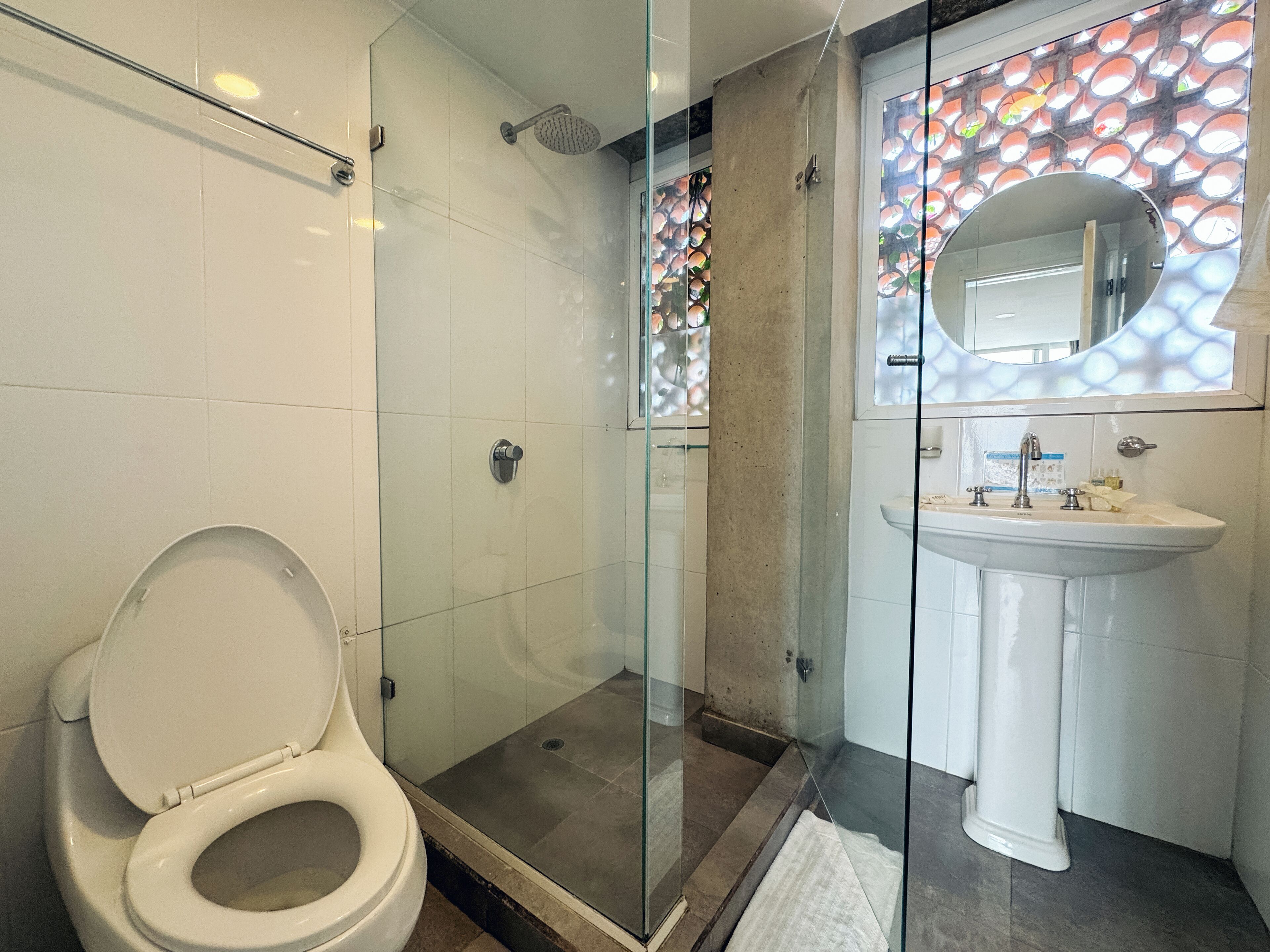 Shower, rainfall showerhead, hair dryer, towels