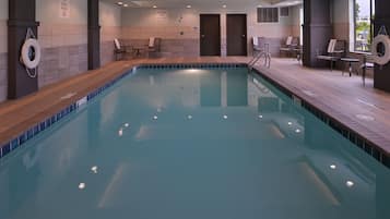 Indoor pool, open 9:00 AM to 9:00 PM, pool loungers