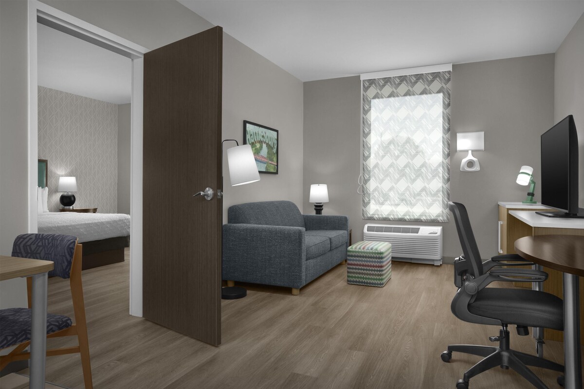 Suite, 1 King Bed, Accessible, Non Smoking (Roll-in Shower) | Living area | 55-inch flat-screen TV with cable channels, TV