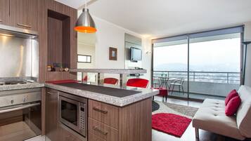Apartment, 1 Bedroom | Living area | Flat-screen TV