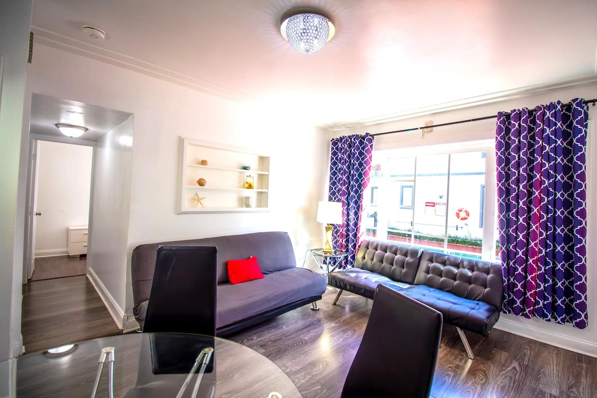 Family Apartment, 2 Bedrooms | Living area | 32-inch flat-screen TV with cable channels, TV