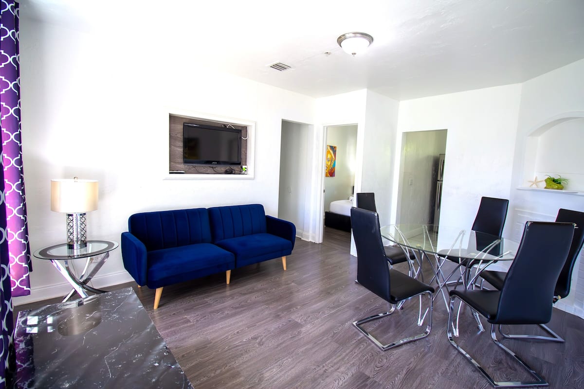 Exclusive Apartment, 2 Bedrooms | Living area | 32-inch flat-screen TV with cable channels, TV