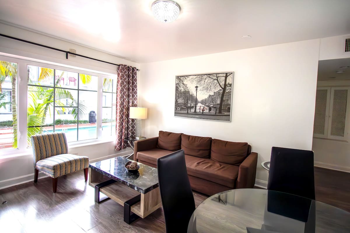 Elite Apartment, 2 Bedrooms | Living area | 32-inch flat-screen TV with cable channels, TV