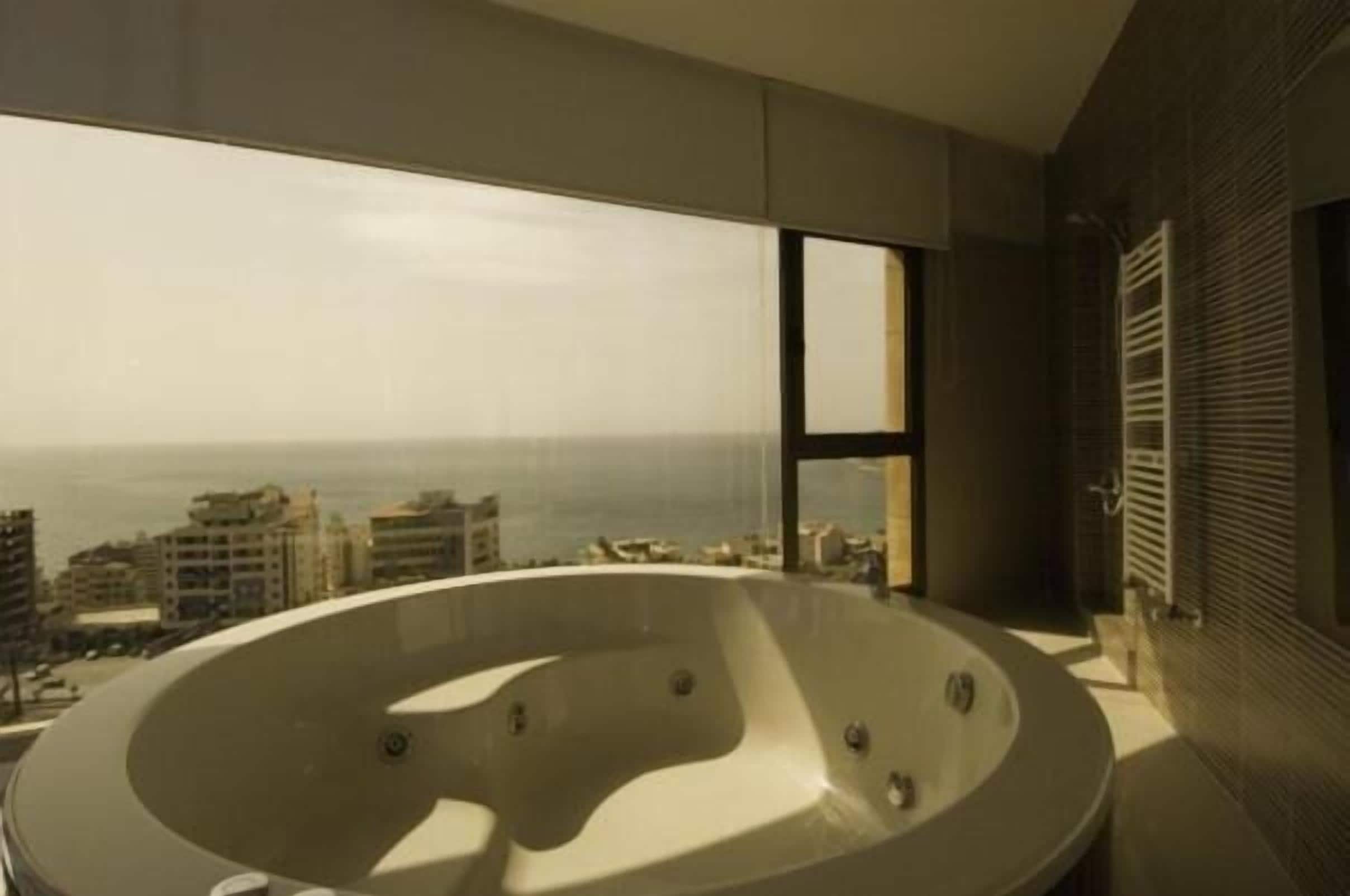 Separate tub and shower, jetted tub, hair dryer, bathrobes