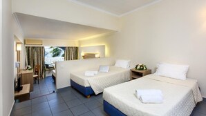 A hotel room with two beds, a desk, and a chair. - Zante Imperial Beach Hotel (Zakynthos)