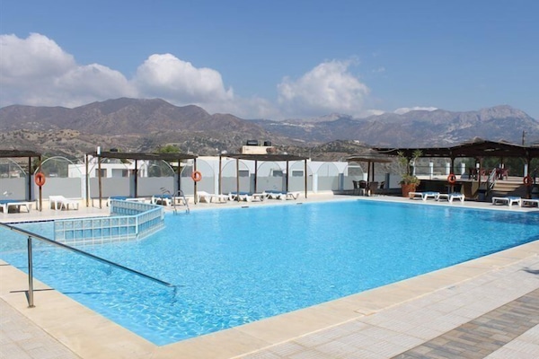 Seasonal outdoor pool, open 7:30 AM to 8:00 AM, pool umbrellas