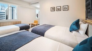 A hotel room with two beds, a window with a city view, a small table, and a chair. - HOTEL MYSTAYS Nagoya Sakae　Renewed in September 2026 – All Guest Rooms & Breakfast (NAGOYA)