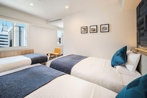 A hotel room with two beds, a window with a city view, a small table, and a chair. - HOTEL MYSTAYS Nagoya Sakae　Renewed in September 2026 – All Guest Rooms & Breakfast (NAGOYA)