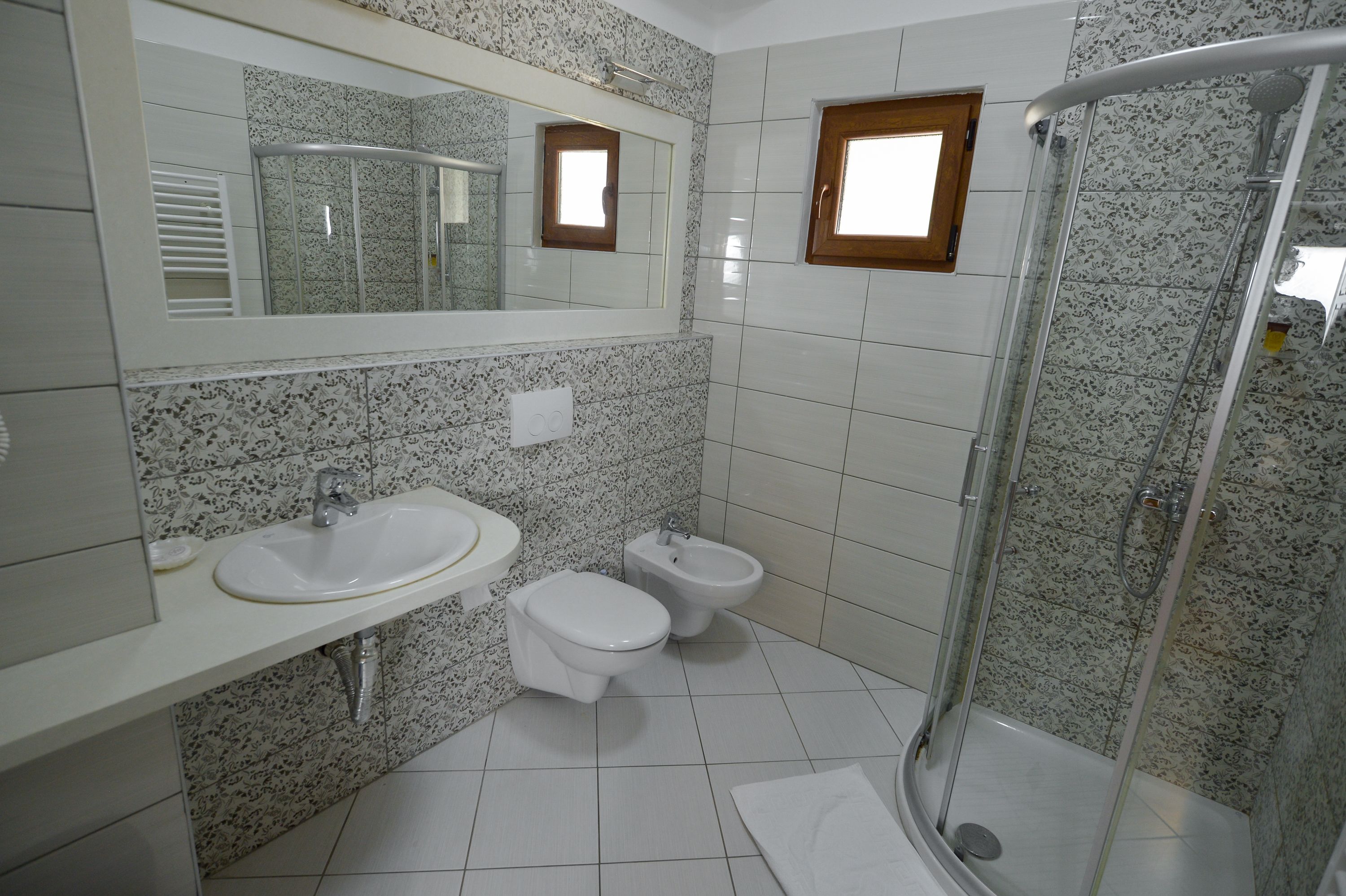 deluxe double room, balcony | bathroom | free toiletries, hair dryer, slippers, towels
