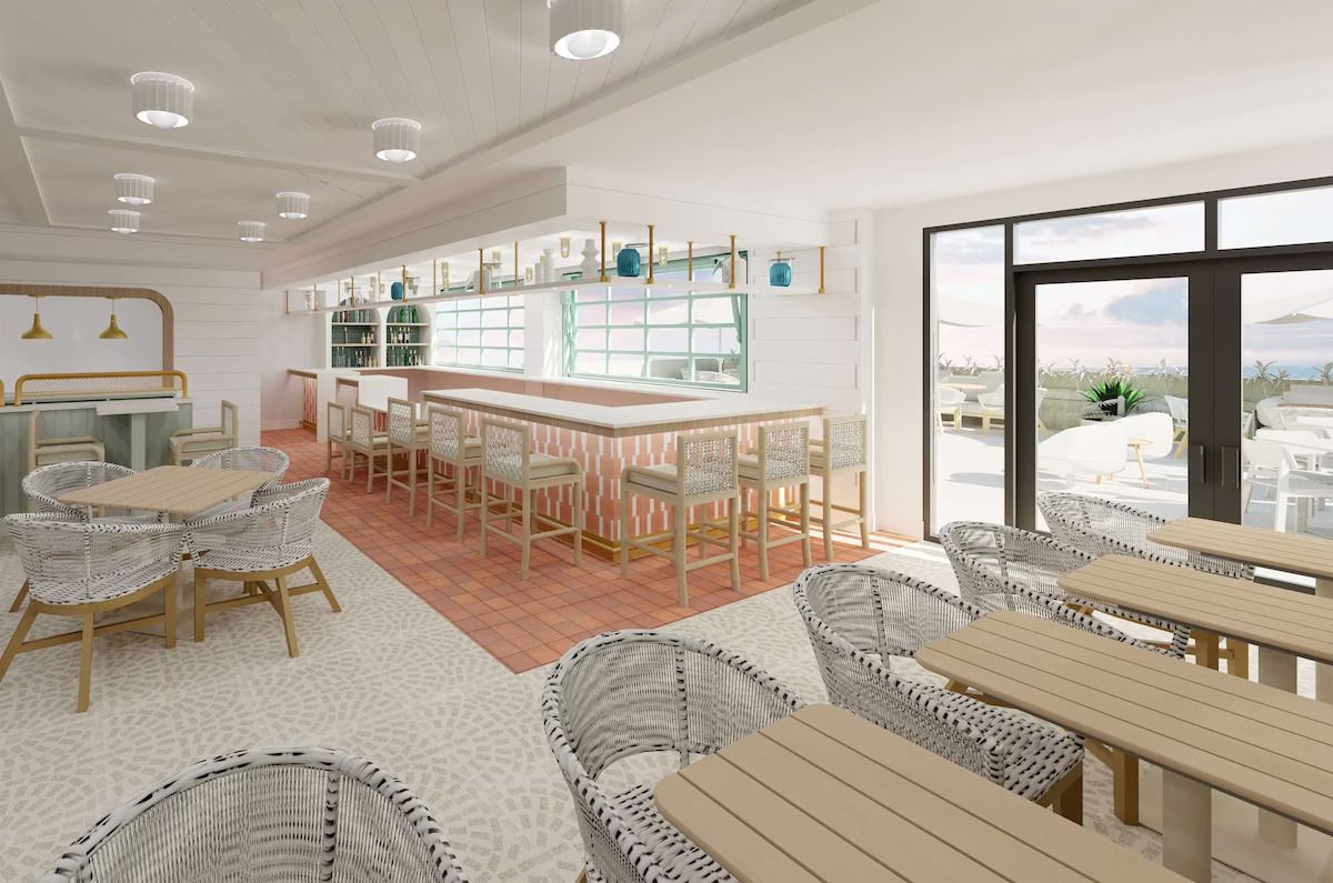 A modern interior with a bar area, wicker furniture, and large windows offering a view.