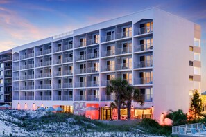 A multi-story hotel with balconies, a beach view, and outdoor seating areas. - Bealhousefort Walton Beachfront Tapestrycollection (Fort Walton Beach)