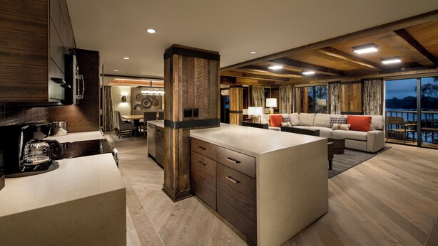 A modern interior with a kitchen, dining area, and living room. - Copper Creek Villas and Cabins at Disneys Wilderness Lodge (Lake Buena Vista)