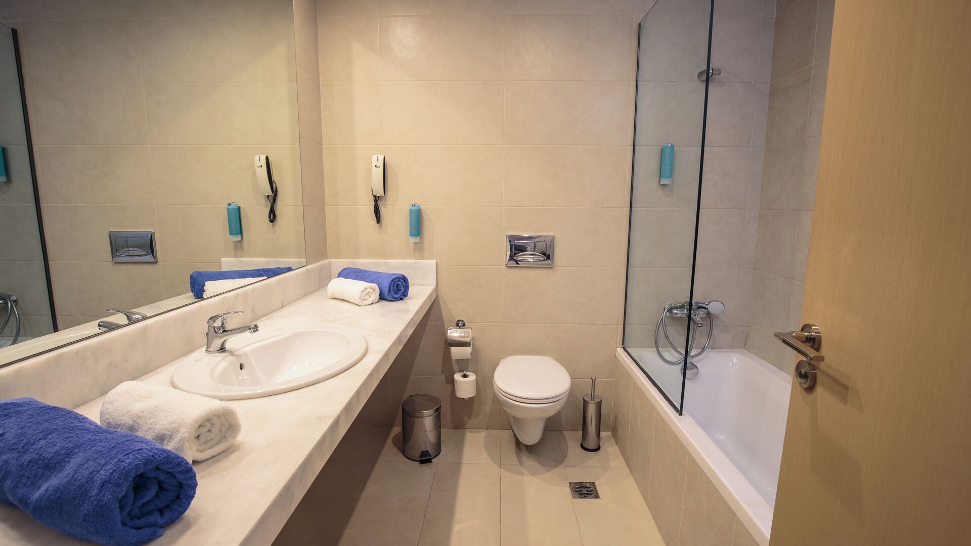 hair dryer, bathrobes, slippers, towels