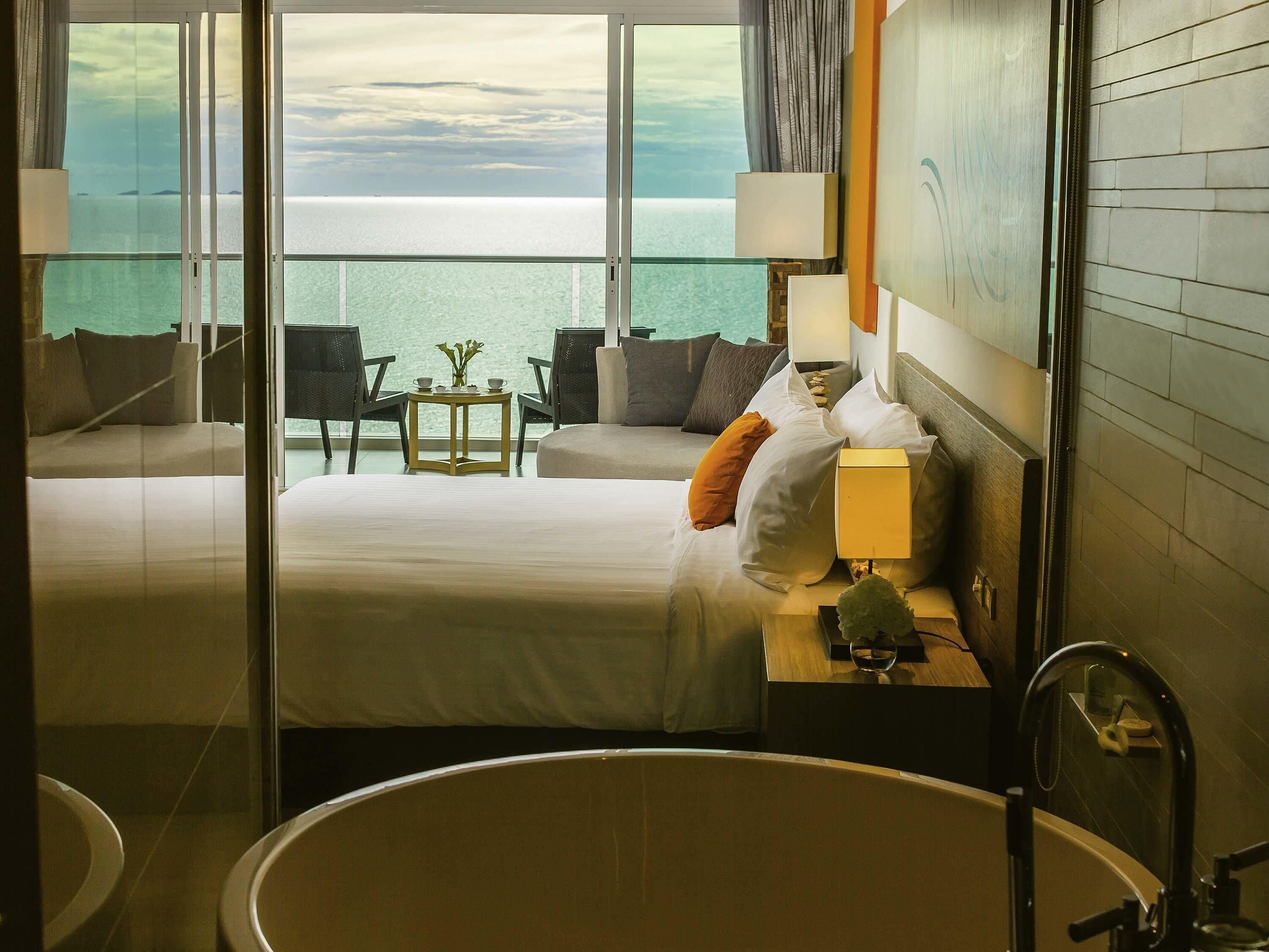 Habitación Deluxe, 1 cama King size, vista al mar | Sábanas de algodón egipcio, ropa de cama de alta calidad y minibar 
