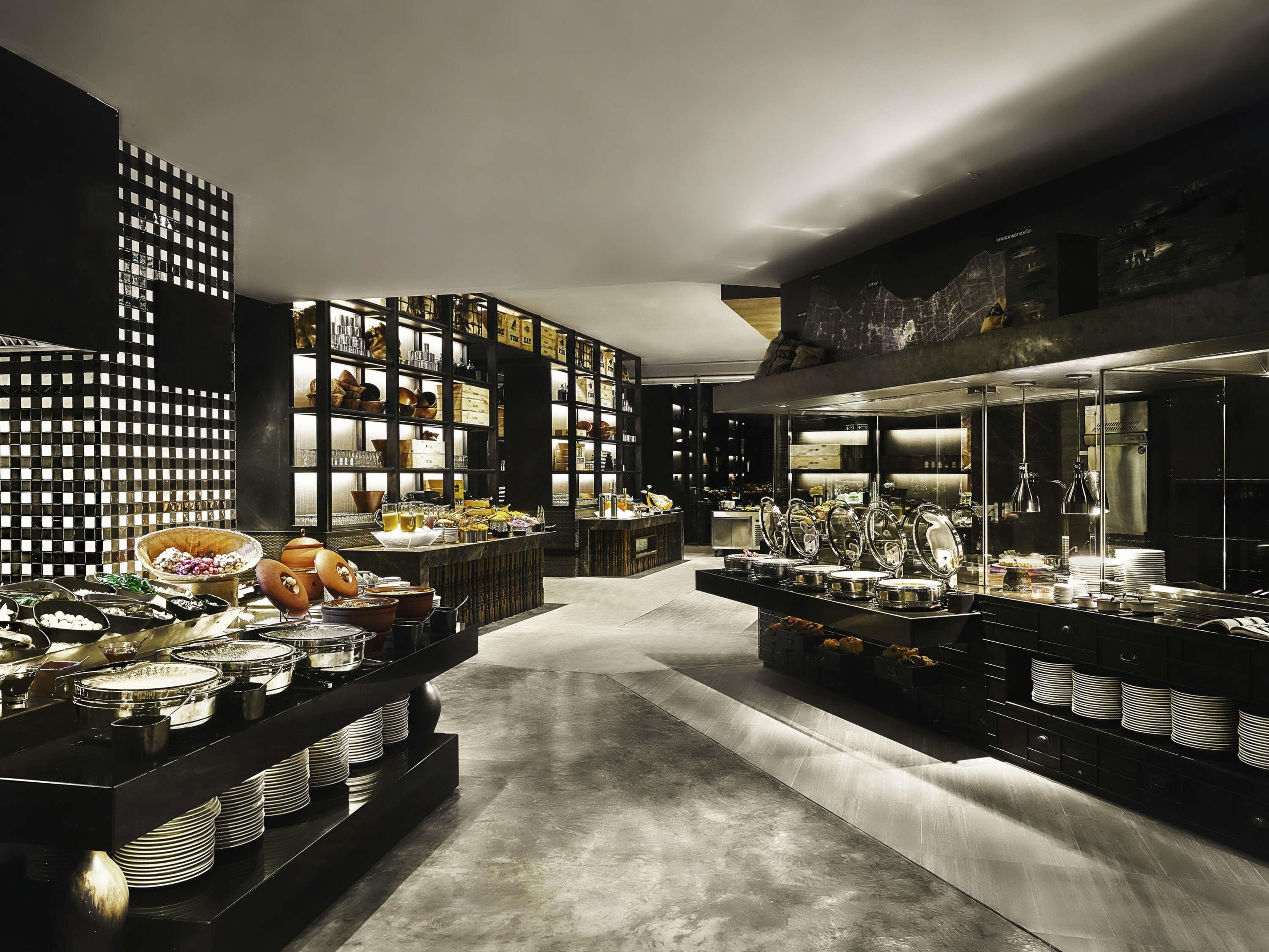 A modern kitchen with high-end appliances and a variety of cookware and utensils.