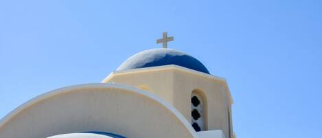 A building with a dome and a cross on top.