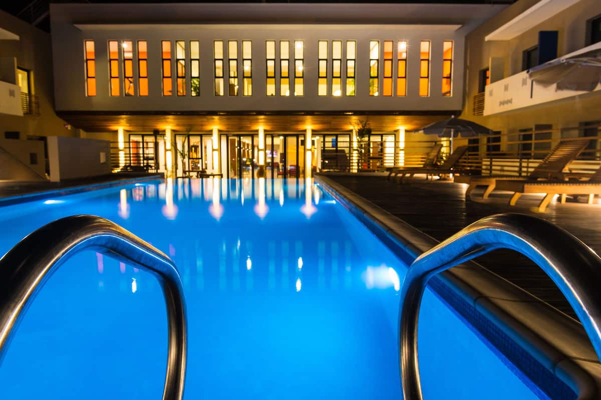 outdoor pool, open 7:00 am to 7:00 pm, pool umbrellas, pool loungers