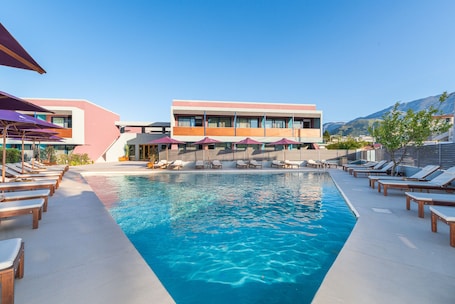 Outdoor pool, open 10:00 AM to 8:00 PM, pool umbrellas, sun loungers