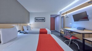 A hotel room with two beds, a desk, a chair, a TV, and a framed picture on the wall. - City Express by Marriott Toluca (Toluca)