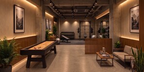 Un espace de détente moderne comprenant une table de billard, des sièges et du matériel d’exercice.