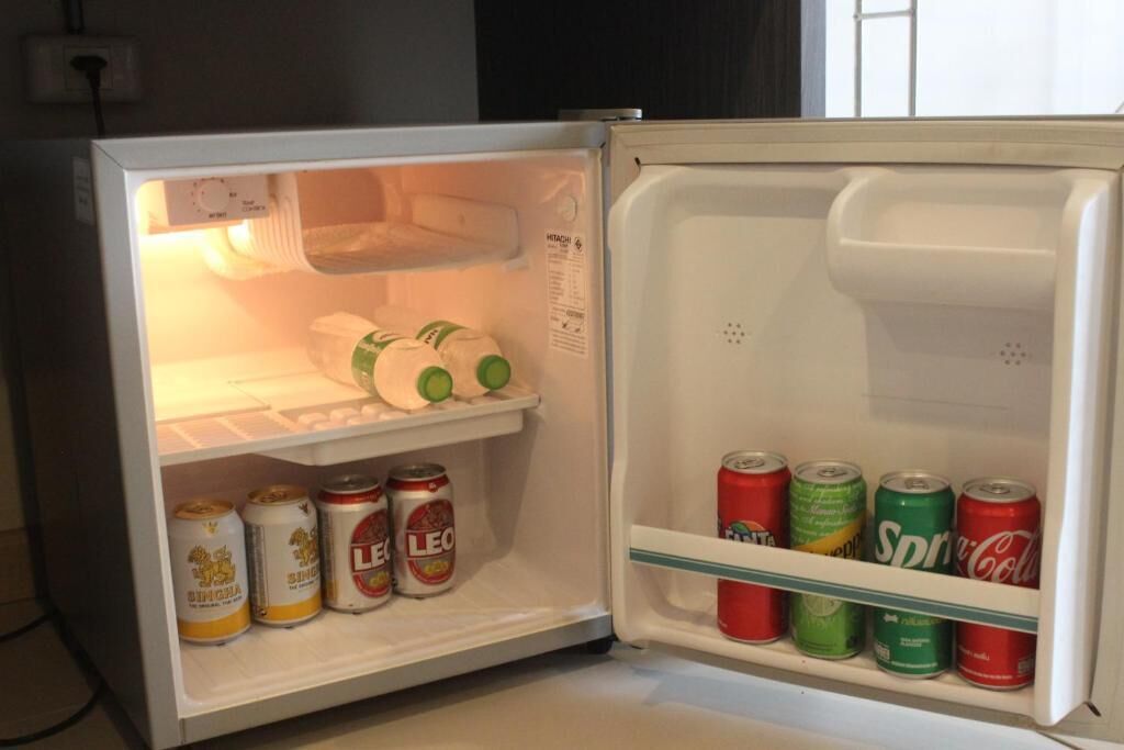 A refrigerator with beverages inside.