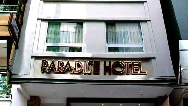 A hotel sign with the name "Paradise Hotel" in bold, capital letters. - Paradise Hotel (Da Nang)