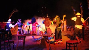 A group of people dancing around a table with bottles. - Rubi Hotel (Alanya)