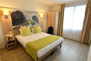 Premium bedding, blackout curtains, soundproofing, iron/ironing board