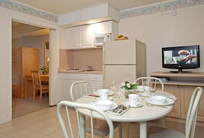 Suite, 1 Bedroom, Oceanfront (C/D) | Living area | Flat-screen TV