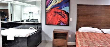 Standard Room, 1 King Bed, Jetted Tub | Iron/ironing board, free WiFi, bed sheets