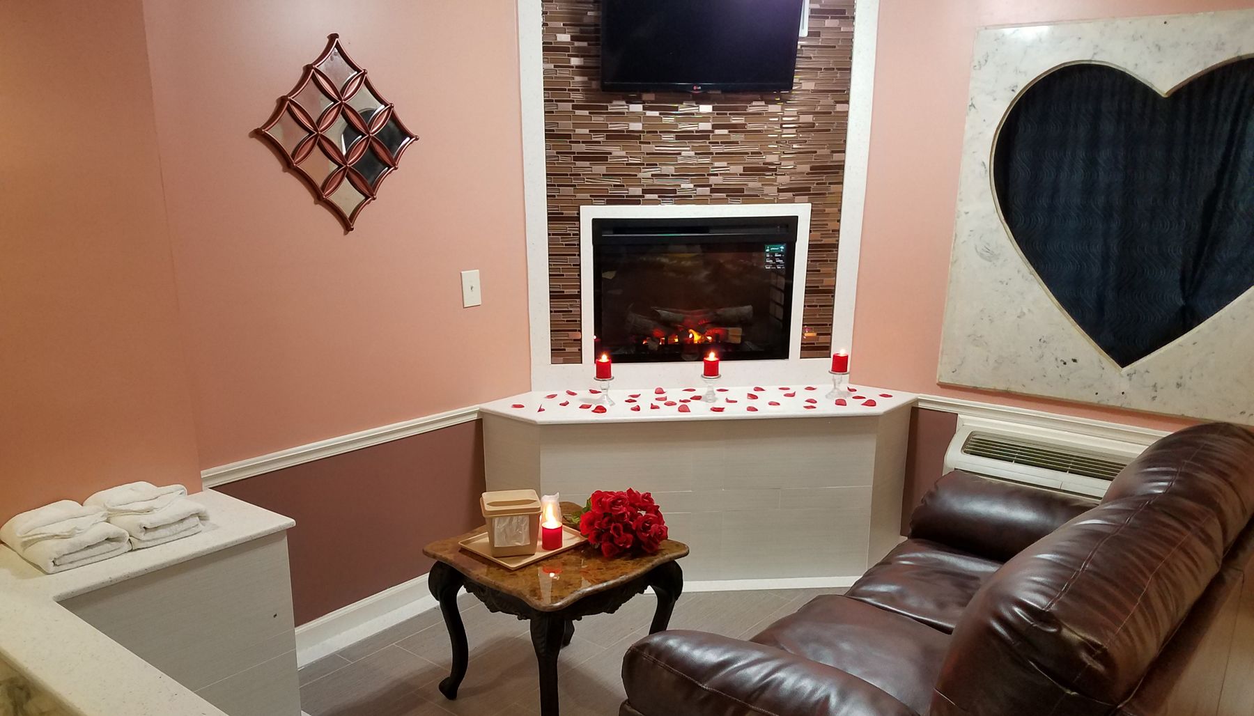 Deluxe Room, 1 King Bed, Non Smoking | Living area | 32-inch flat-screen TV with cable channels, TV, fireplace