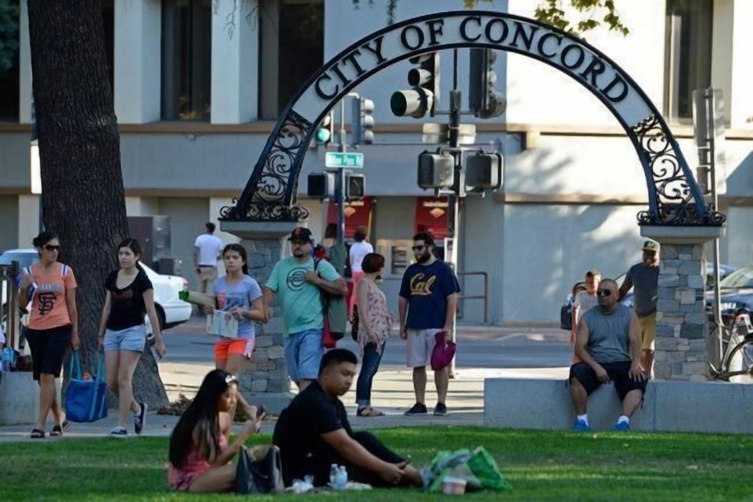 A public square with a prominent archway labeled "City of Concord."