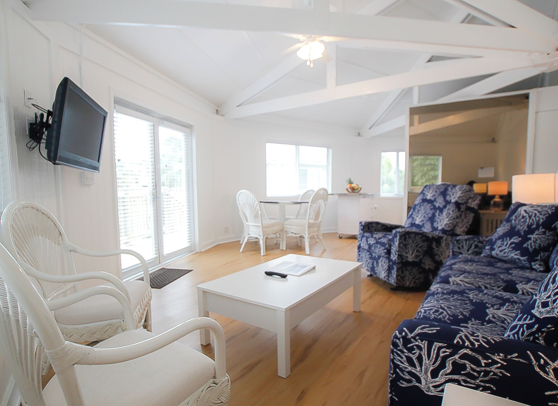 Condo, Multiple Beds | Living area | Flat-screen TV, books
