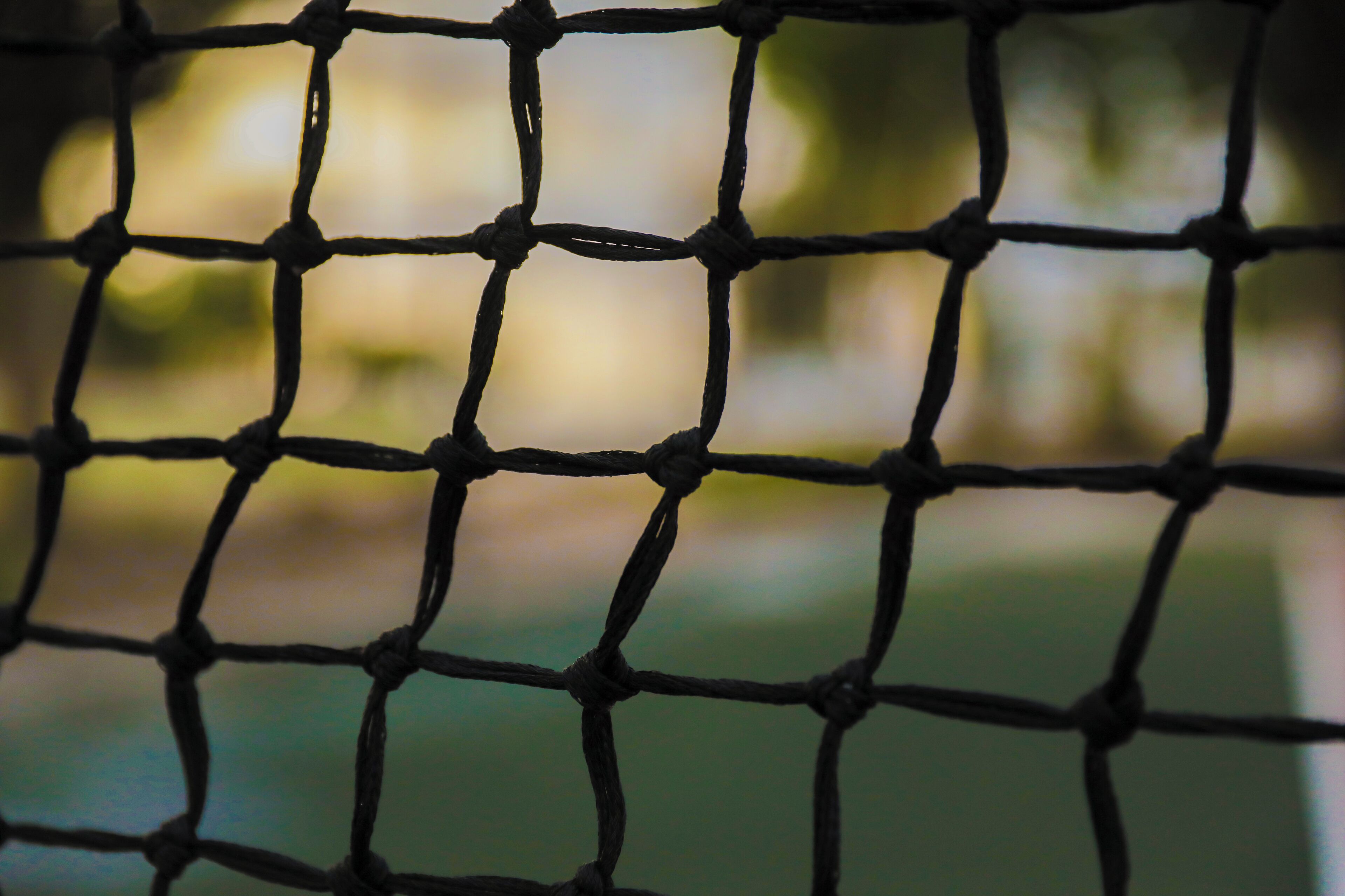 A close-up of a net with a blurred background.
