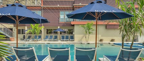 Outdoor pool, pool umbrellas, sun loungers