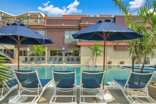 Outdoor pool, pool umbrellas, sun loungers