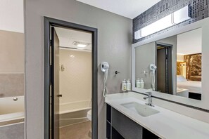 Suite, 1 King Bed, Non Smoking, Jetted Tub | Bathroom | Free toiletries, hair dryer, towels - The Wander Hotel, a Ramada by Wyndham (Gatlinburg)
