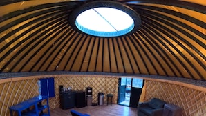 A yurt interior with a bed, seating area, and a small table. - Boulder Mountain Guest Ranch (Boulder)