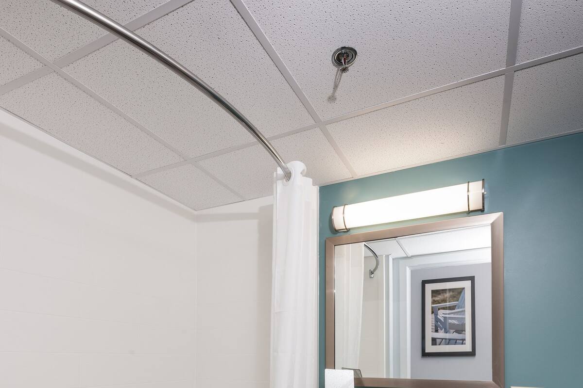 economy single room, 1 king bed | bathroom | hair dryer, towels