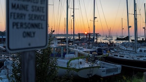 A marina with boats docked at sunset. - Rockland Harbor Hotel (Rockland)