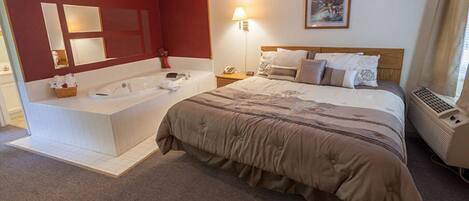 Room, 1 King Bed, Jetted Tub | Blackout drapes, iron/ironing board, free WiFi, bed sheets