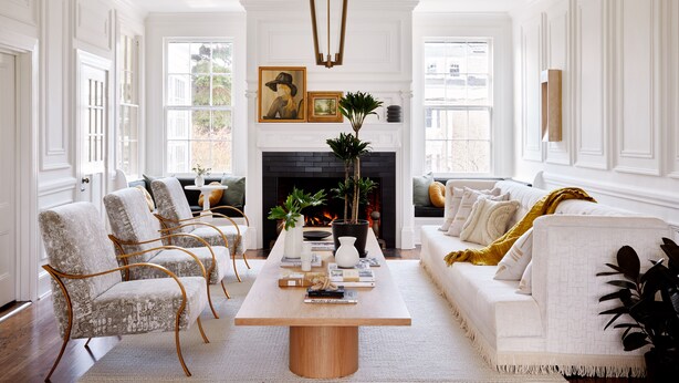 A spacious living room with a fireplace, white walls, and a large window. - Kennebunkport Captains Collection (Kennebunkport)