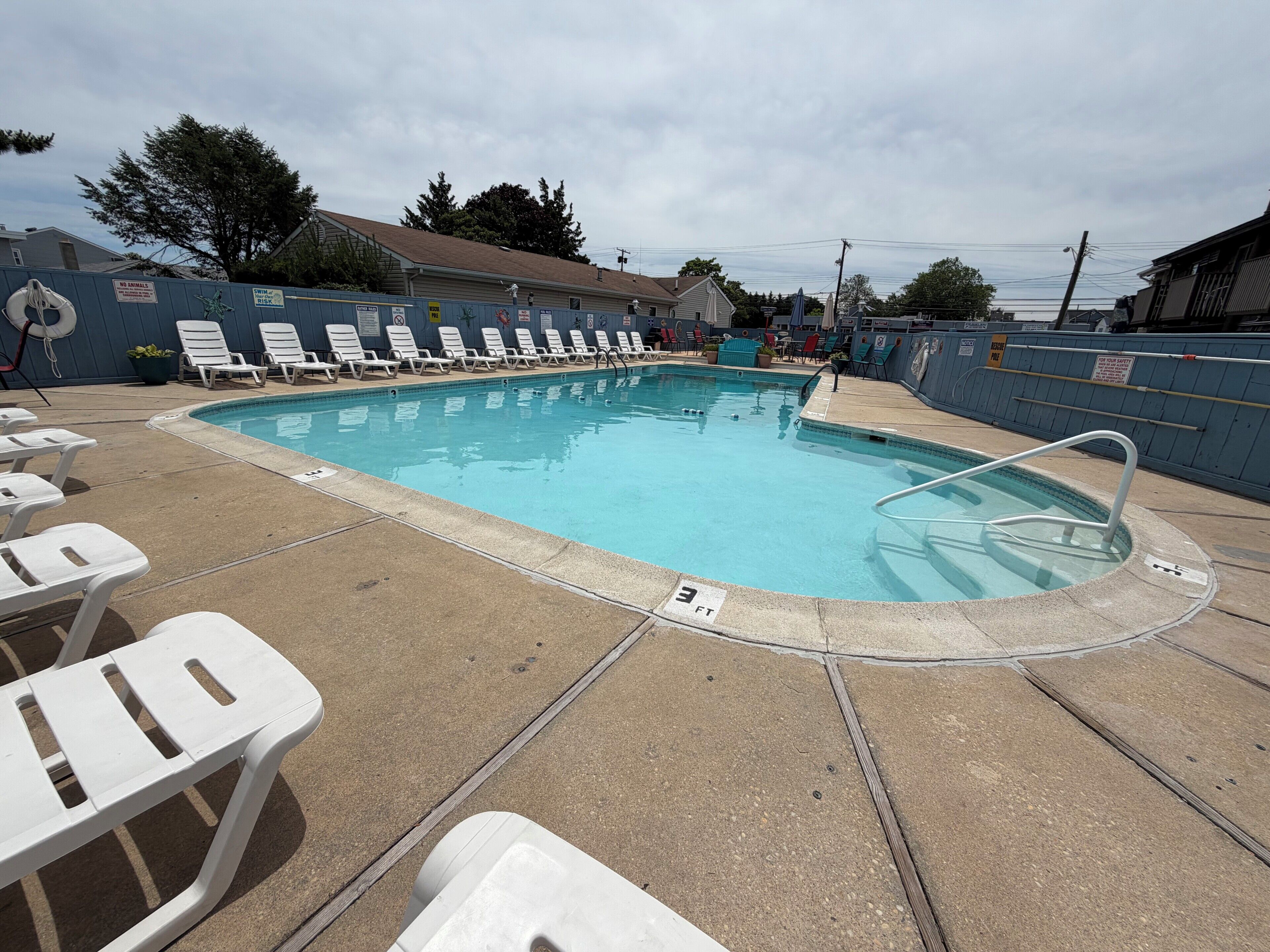 Seasonal outdoor pool, open 9:00 AM to 10:00 PM, pool umbrellas