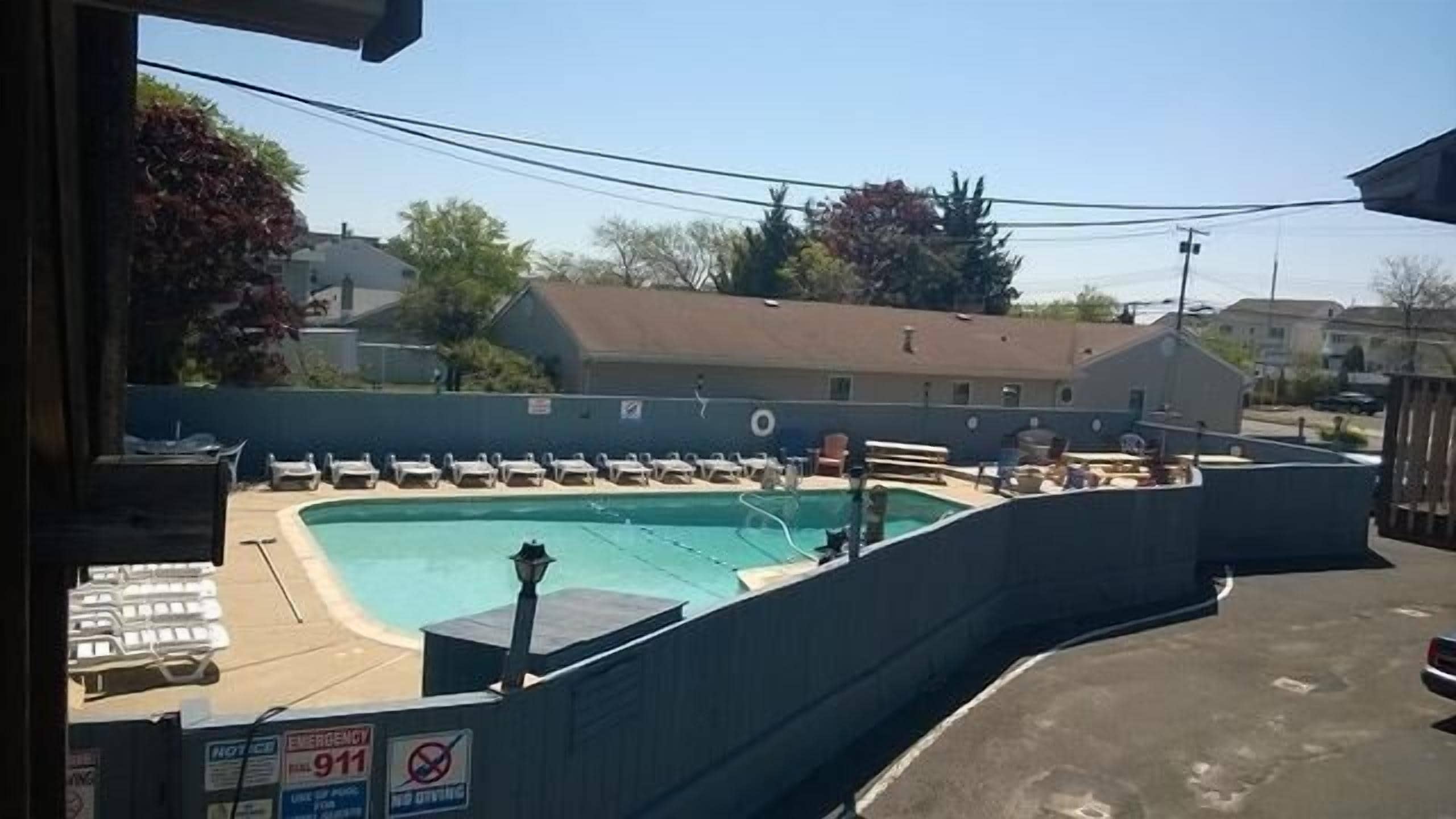 Seasonal outdoor pool, open 9:00 AM to 10:00 PM, pool umbrellas