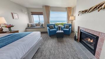 Habitación, 1 cama de matrimonio grande, chimenea, frente al mar | Escritorio y espacio para trabajar con un portátil