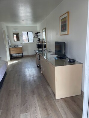 Desk, laptop workspace, blackout drapes, iron/ironing board