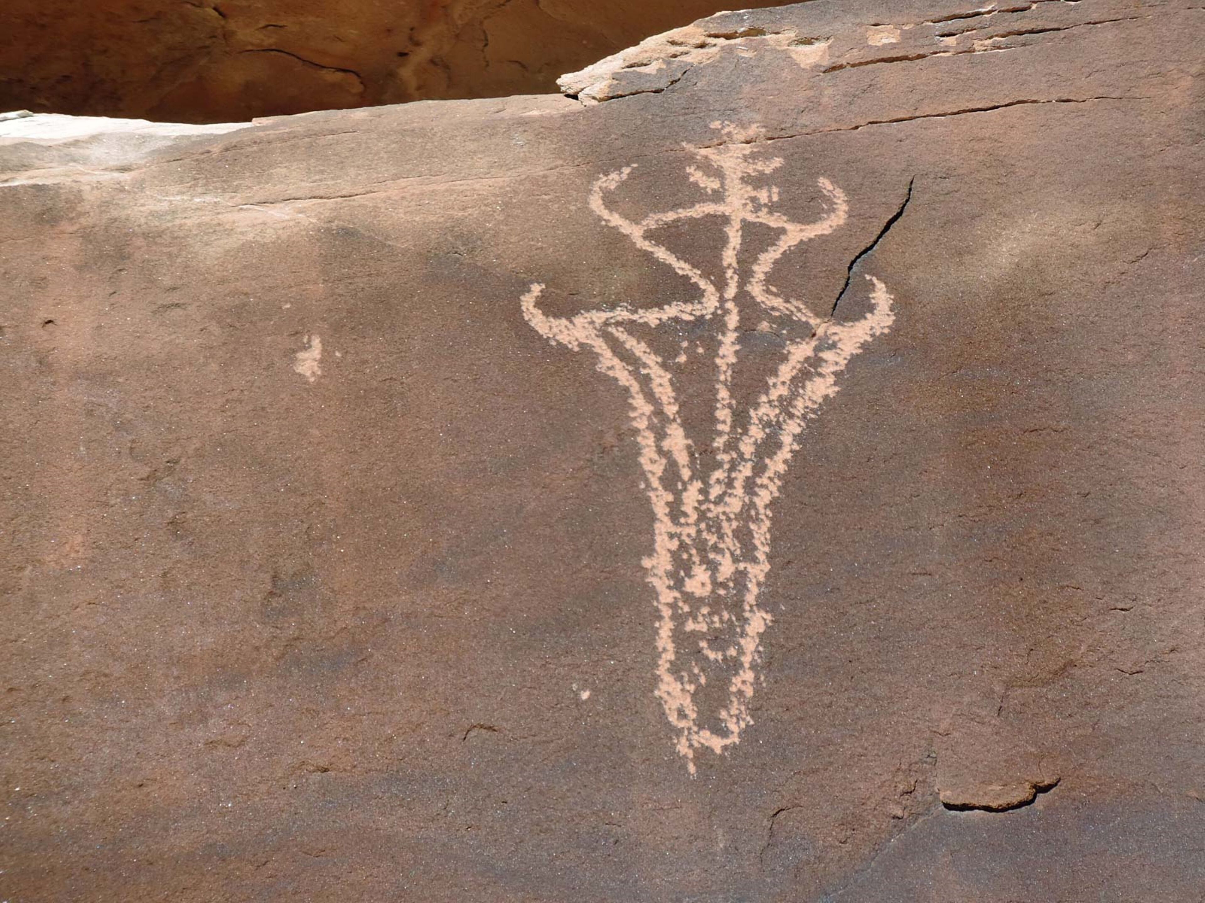 A rock with a carved symbol.