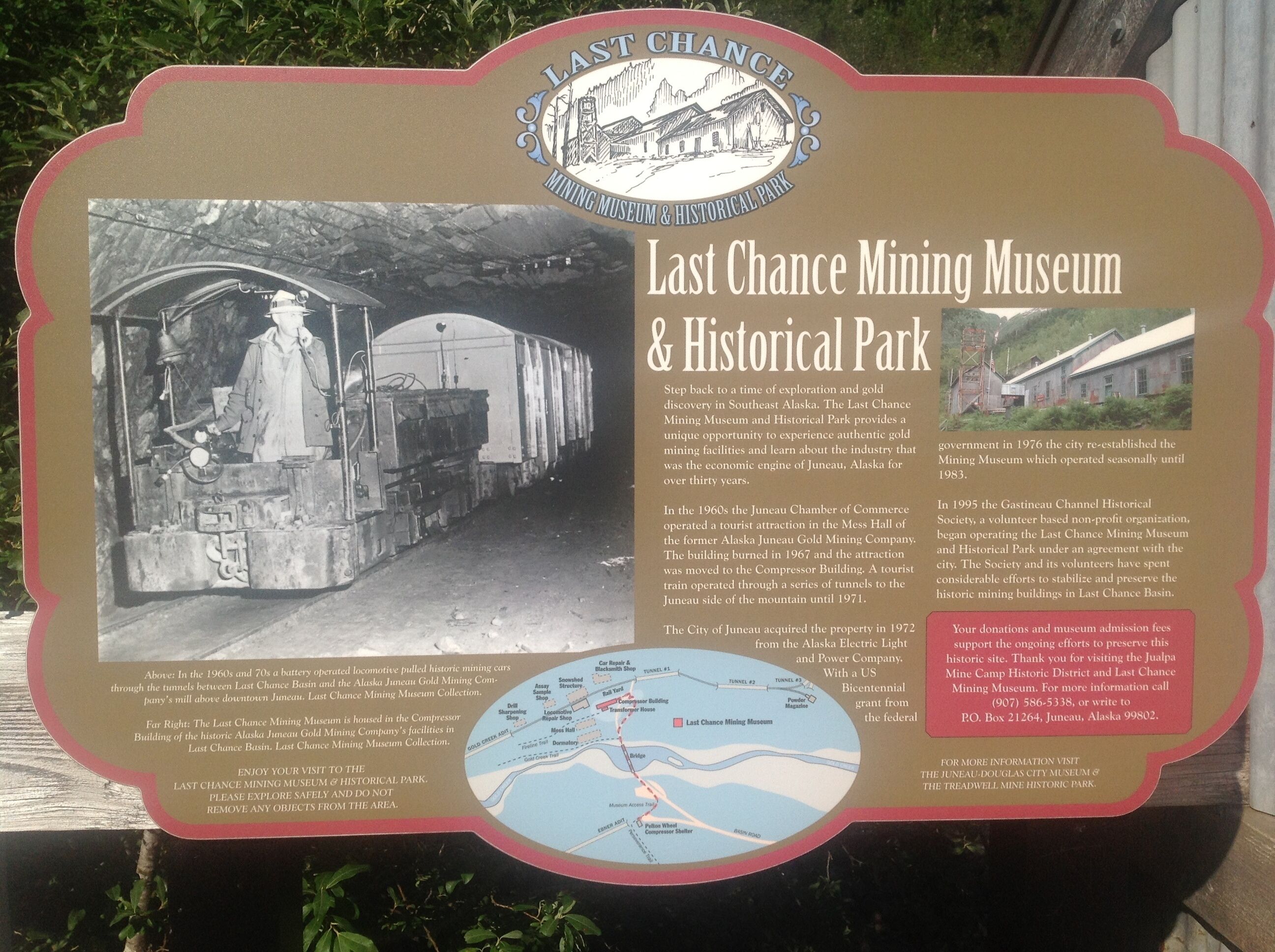 A historical sign for the Last Chance Mining Museum & Historical Park, detailing its history and attractions.