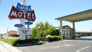 A motel sign with "Sahara Motel" and "TV Pool" indicating amenities. - Sahara Motel (Anaheim)