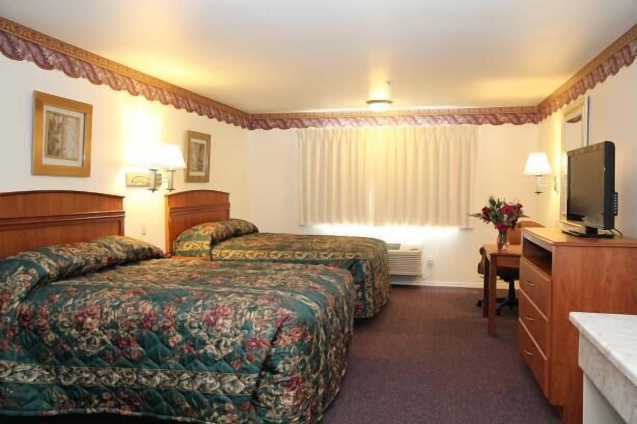 standard room, 2 queen beds | pillow-top beds, desk, blackout curtains, iron/ironing board